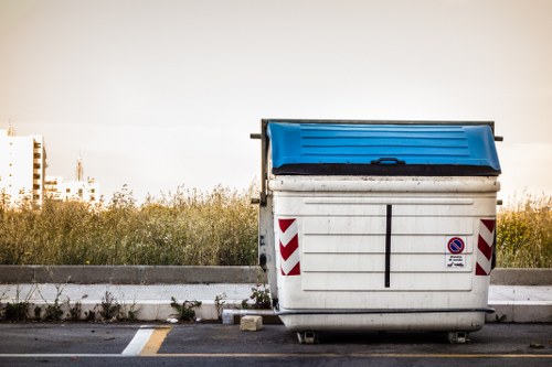 Residential waste removal service in progress in Merton